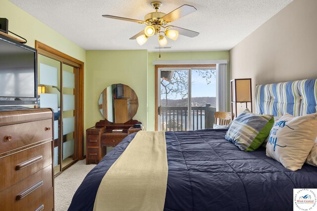 1436 Cherokee Rd, Lake Ozark, MO 65049 - carpeted bedroom featuring a textured ceiling, visible vents, ceiling fan, and access to outside