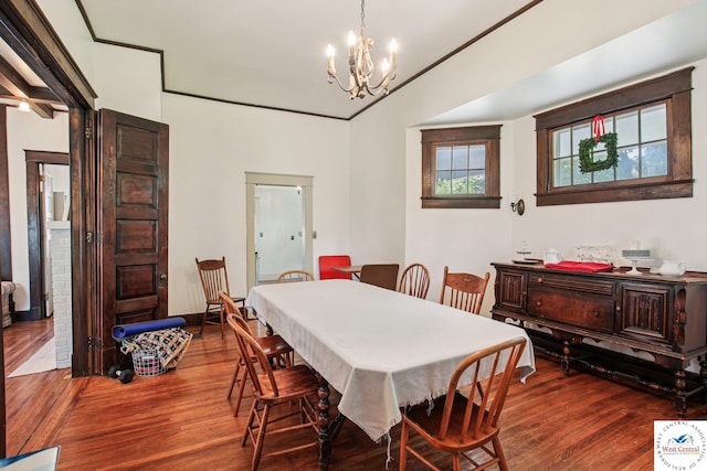 309 E Gay St, Warrensburg, MO 64093 - dining room featuring dark wood-style floors and a chandelier
