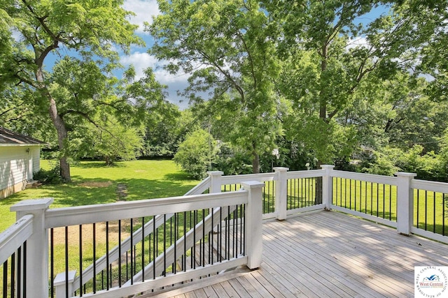 309 E Gay St, Warrensburg, MO 64093 - wooden deck featuring a lawn and view of scattered trees