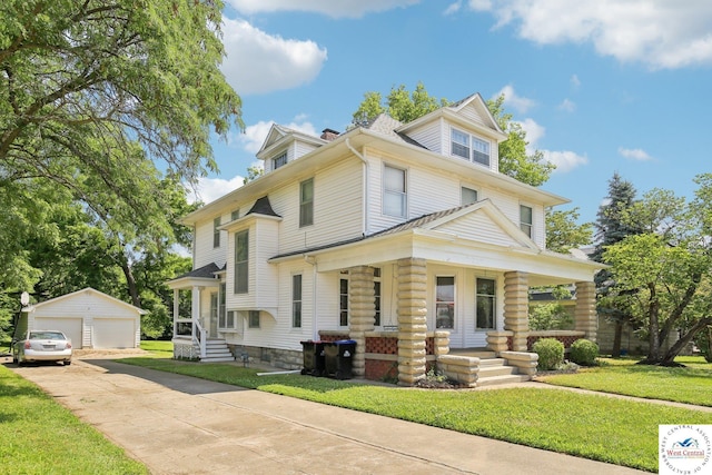 309 E Gay St, Warrensburg, MO 64093 - american foursquare style home with an outbuilding, a garage, a porch, and a front yard