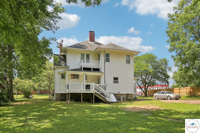 309 E Gay St, Warrensburg, MO 64093 - back of property with a chimney, a balcony, and stairway