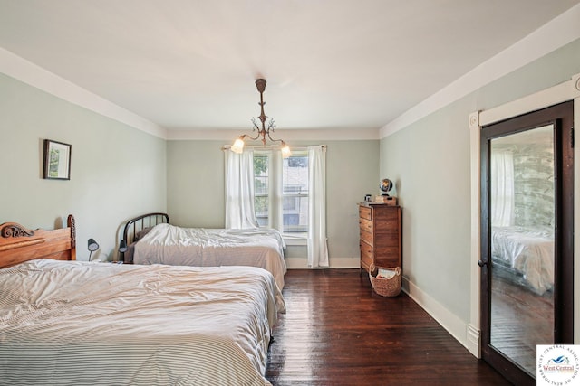 309 E Gay St, Warrensburg, MO 64093 - bedroom with wood finished floors and baseboards
