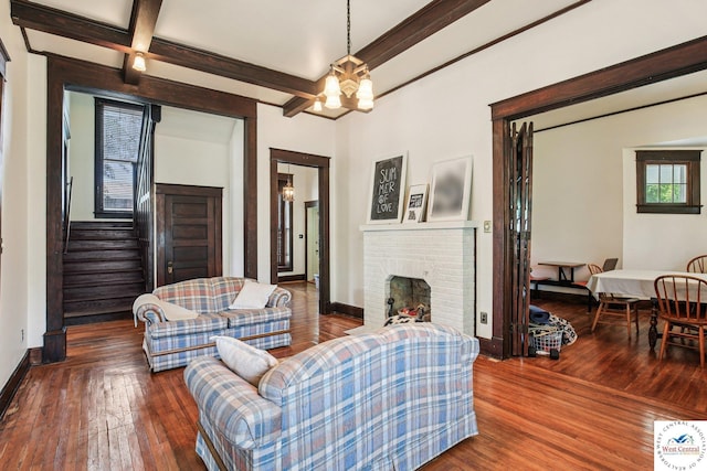 309 E Gay St, Warrensburg, MO 64093 - living room featuring hardwood / wood-style flooring, a chandelier, stairs, beamed ceiling, and coffered ceiling