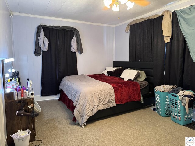 405 W 4th St, Sedalia, MO 65301 - bedroom with ornamental molding, carpet, and a ceiling fan