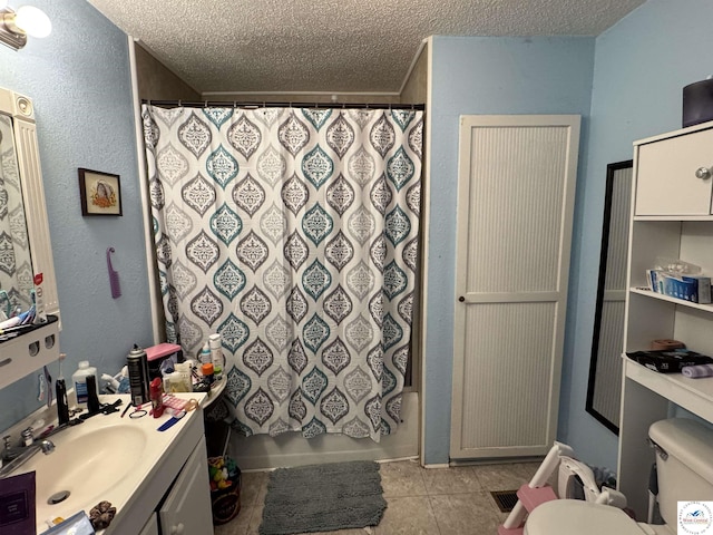 405 W 4th St, Sedalia, MO 65301 - bathroom with toilet, a textured ceiling, tile patterned flooring, and vanity