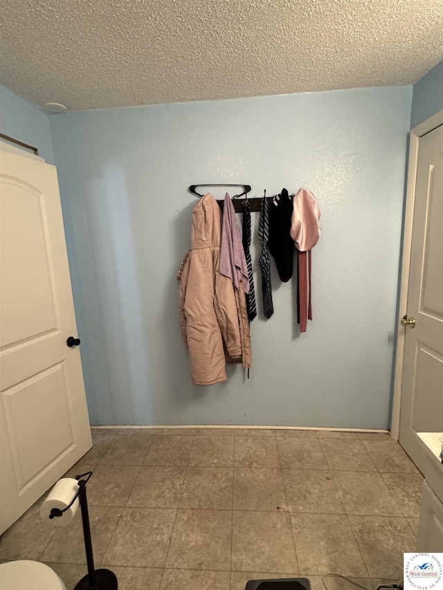 405 W 4th St, Sedalia, MO 65301 - bathroom with a textured ceiling