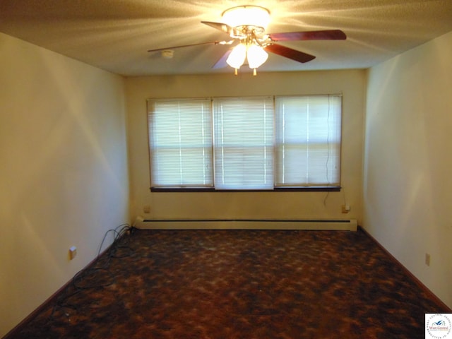 empty room featuring baseboard heating, a ceiling fan, and carpet flooring