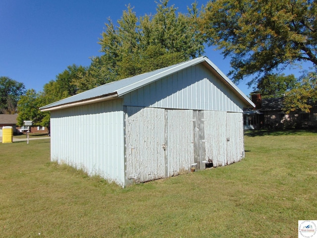 view of pole building with a yard