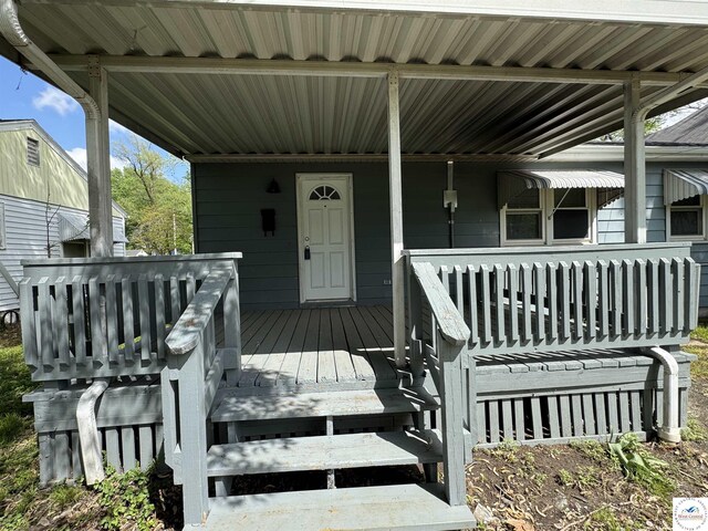 1404 S Grand Ave, Sedalia, MO 65301 - property entrance featuring a porch