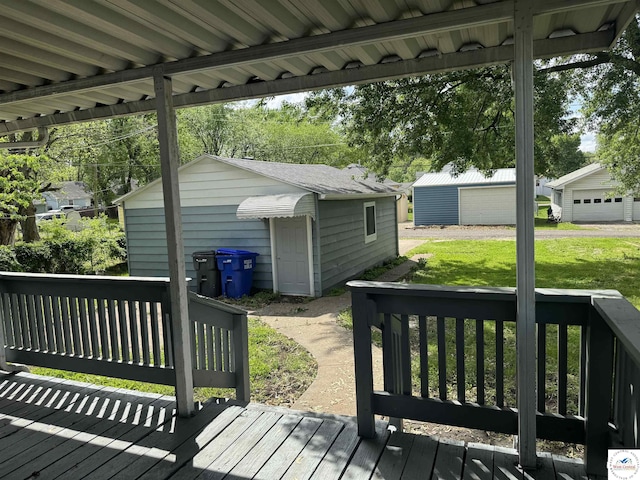 1404 S Grand Ave, Sedalia, MO 65301 - deck featuring a lawn and an outdoor structure