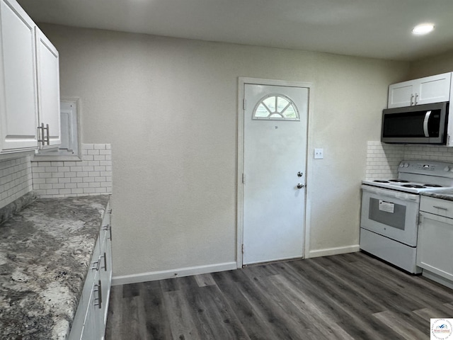 1404 S Grand Ave, Sedalia, MO 65301 - kitchen featuring dark wood-style flooring, white cabinetry, stainless steel microwave, tasteful backsplash, and white electric range