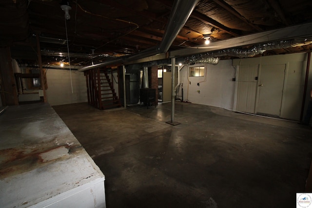 unfinished below grade area featuring stairway