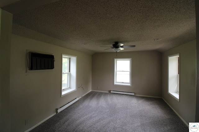 spare room featuring a baseboard heating unit, a ceiling fan, a textured ceiling, carpet floors, and a baseboard radiator