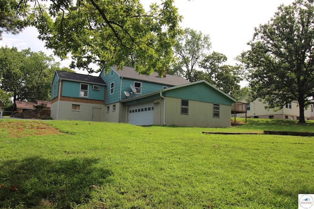 rear view of house with a yard
