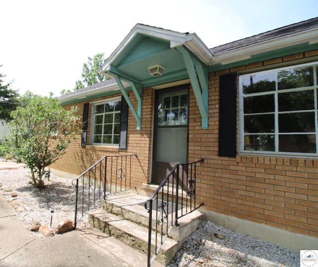 view of front of house featuring brick siding
