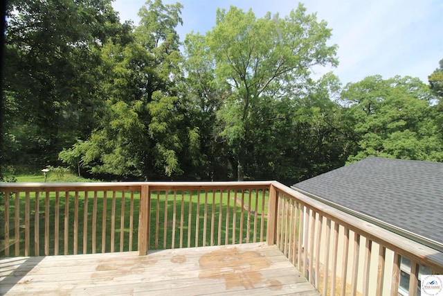 wooden terrace with a yard