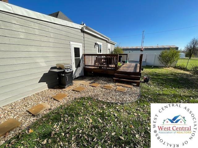 412 E Walnut St, Clinton, MO 64735 - view of green lawn with a deck