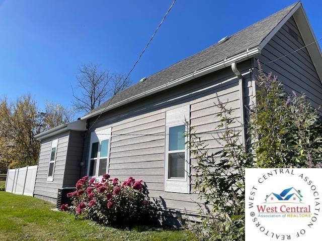 412 E Walnut St, Clinton, MO 64735 - view of home's exterior featuring central AC