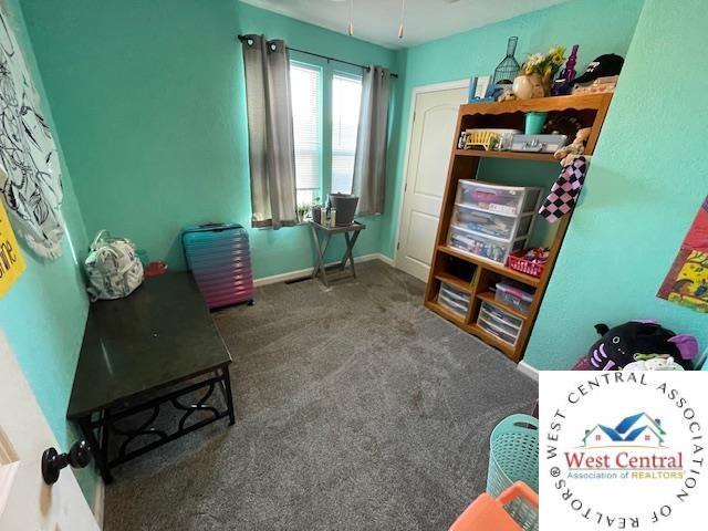 412 E Walnut St, Clinton, MO 64735 - sitting room featuring carpet and baseboards