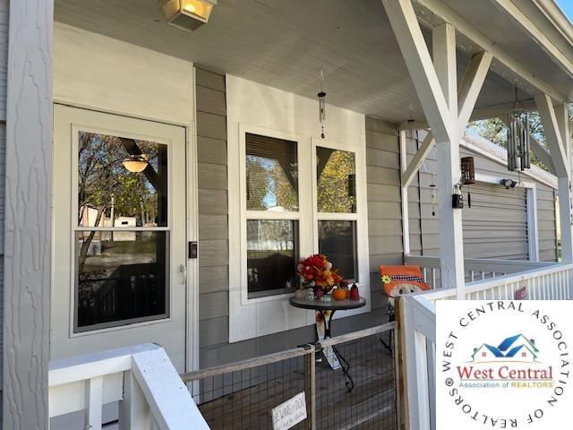 412 E Walnut St, Clinton, MO 64735 - wooden deck featuring covered porch