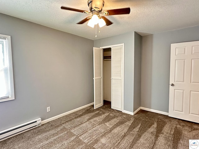 unfurnished bedroom with carpet floors, a baseboard heating unit, a closet, a ceiling fan, and a textured ceiling