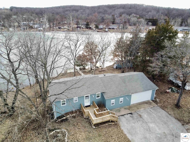aerial view with a wooded view