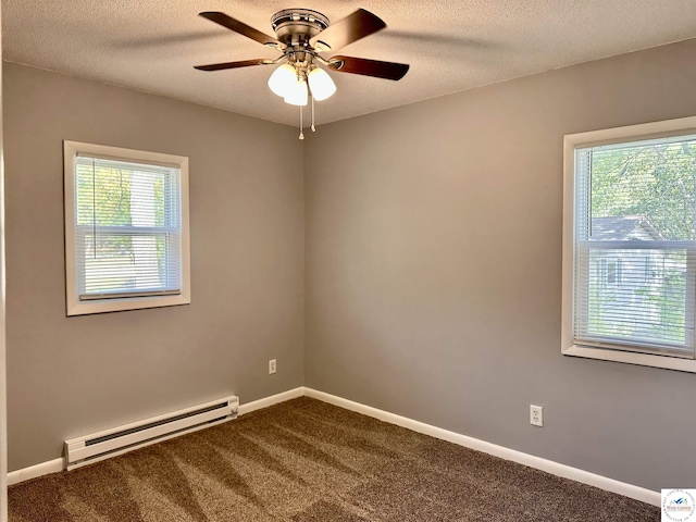 unfurnished room with a ceiling fan, dark carpet, baseboards, a textured ceiling, and a baseboard radiator