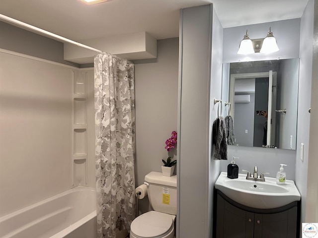 bathroom featuring toilet, shower / bath combo, a wall unit AC, and vanity