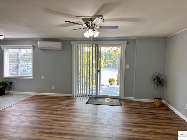 32031 Barclay Loop, Warsaw, MO 65355 - entryway with a wall mounted AC, a ceiling fan, ornamental molding, wood finished floors, and baseboards
