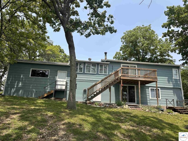 32031 Barclay Loop, Warsaw, MO 65355 - back of property featuring stairs, a deck, and a lawn