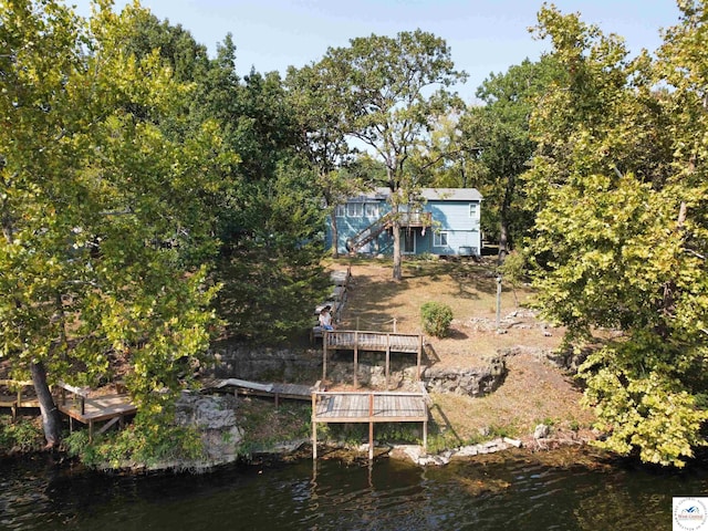 view of dock featuring a deck with water view