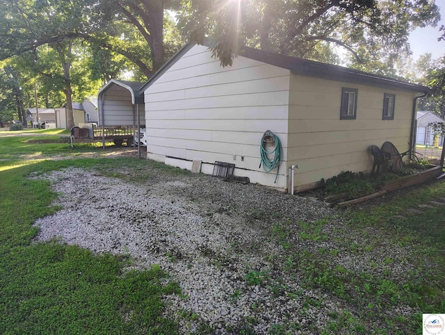 29620 Blue Grass Rd, Edwards, MO 65326 - view of home's exterior featuring a carport