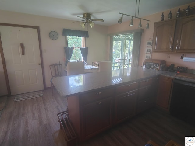 29620 Blue Grass Rd, Edwards, MO 65326 - kitchen featuring a peninsula, a ceiling fan, light countertops, and dark wood finished floors