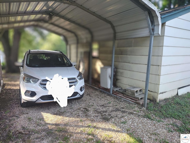 29620 Blue Grass Rd, Edwards, MO 65326 - view of parking / parking lot with a detached carport