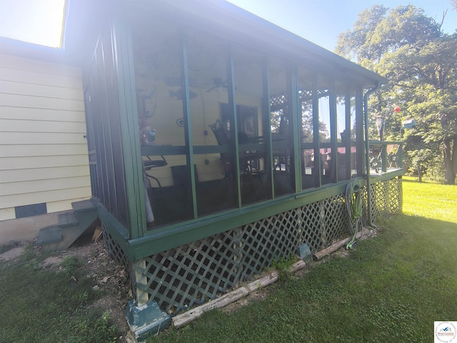 29620 Blue Grass Rd, Edwards, MO 65326 - view of side of property with a sunroom and a lawn