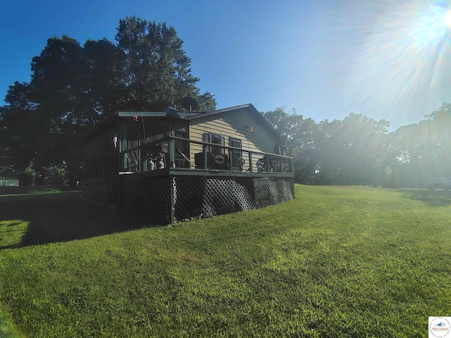 29620 Blue Grass Rd, Edwards, MO 65326 - back of house featuring a wooden deck and a yard