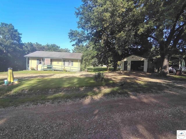 29620 Blue Grass Rd, Edwards, MO 65326 - view of front of property with an outdoor structure, a front lawn, and a garage