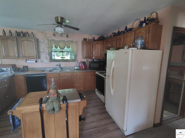 29620 Blue Grass Rd, Edwards, MO 65326 - kitchen featuring black appliances, ceiling fan, wood finished floors, a center island, and light countertops