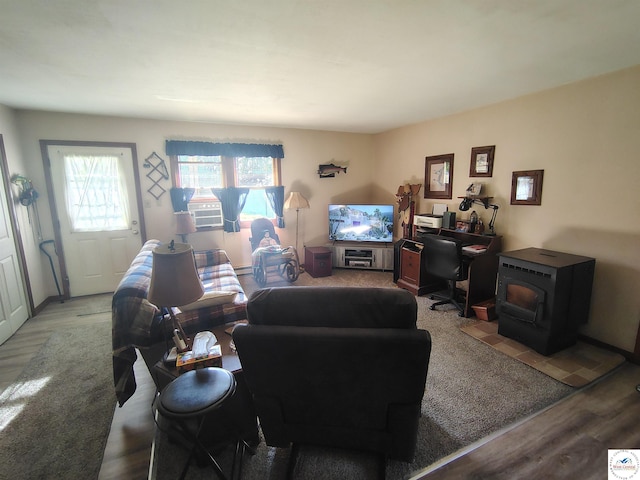 29620 Blue Grass Rd, Edwards, MO 65326 - living room with wood finished floors, an office area, and a wood stove