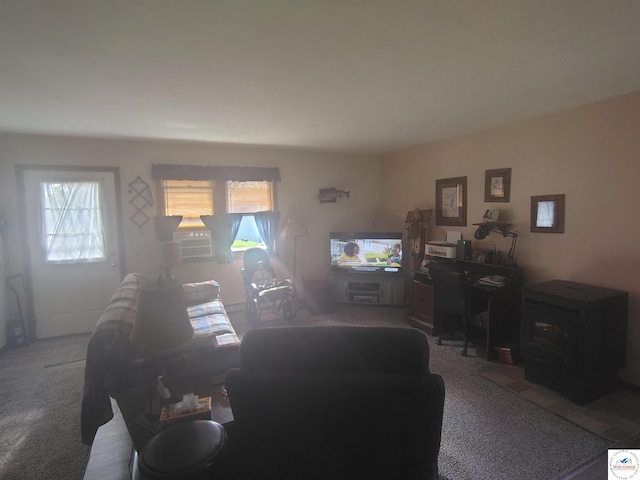 29620 Blue Grass Rd, Edwards, MO 65326 - carpeted living area featuring a wood stove and cooling unit