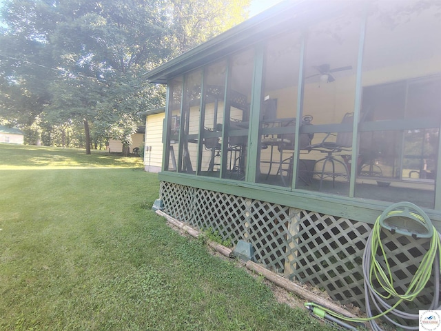 29620 Blue Grass Rd, Edwards, MO 65326 - view of side of home with a sunroom and a yard