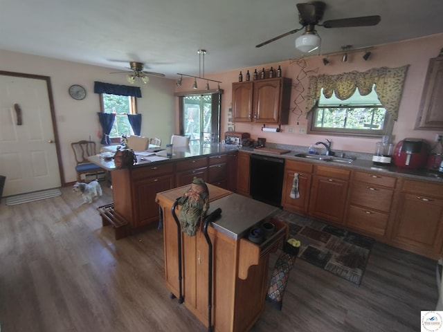 29620 Blue Grass Rd, Edwards, MO 65326 - kitchen featuring a ceiling fan, black dishwasher, a peninsula, and wood finished floors