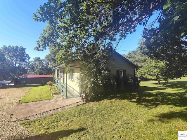 29620 Blue Grass Rd, Edwards, MO 65326 - view of side of home with a yard