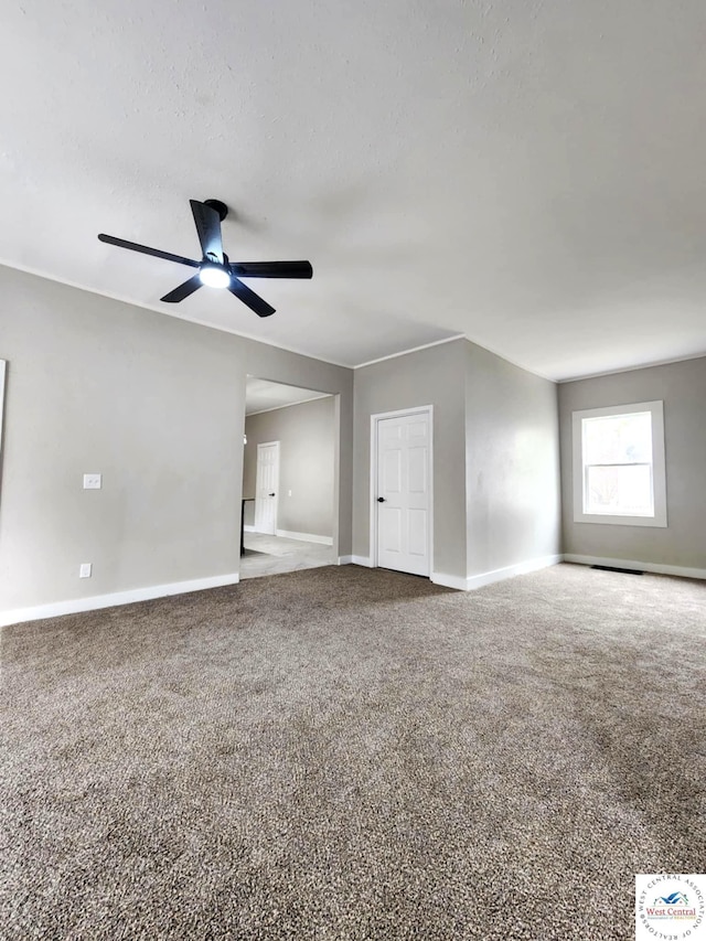 interior space featuring ceiling fan and baseboards