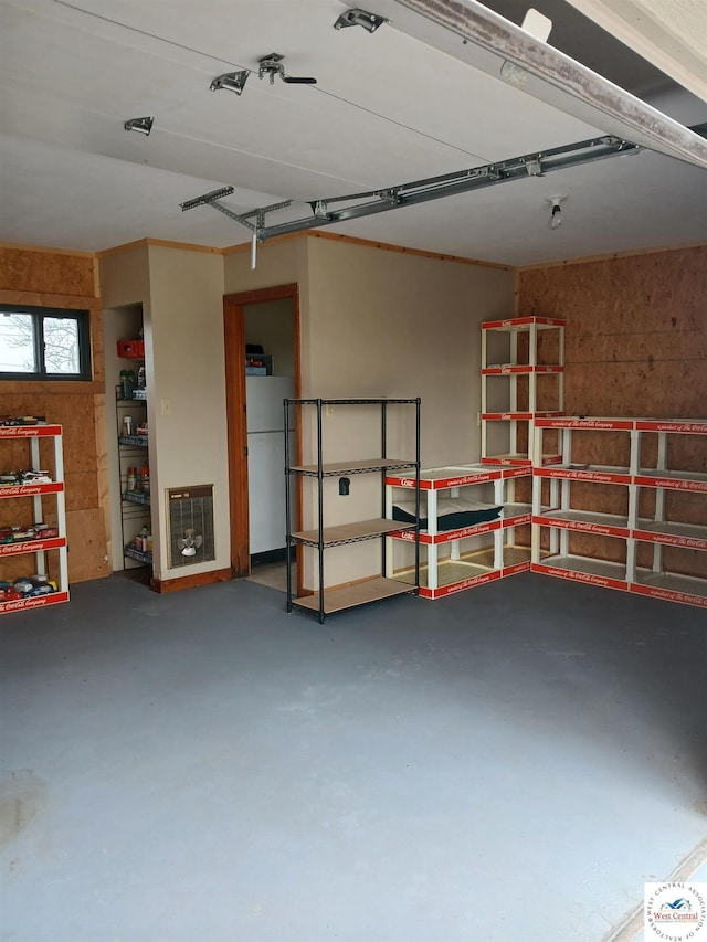 garage with freestanding refrigerator