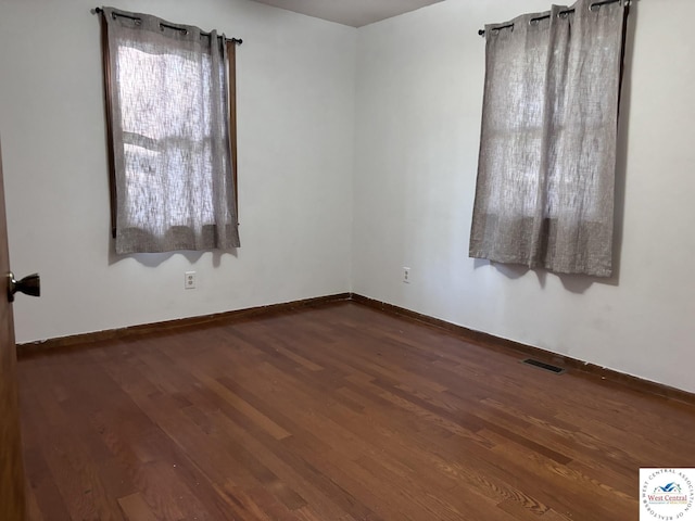 946 Red Bud Dr, Warsaw, MO 65355 - spare room featuring wood finished floors and baseboards