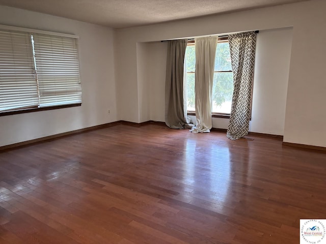 946 Red Bud Dr, Warsaw, MO 65355 - empty room featuring wood finished floors and baseboards