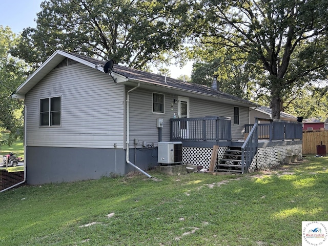 946 Red Bud Dr, Warsaw, MO 65355 - rear view of house featuring cooling unit, a wooden deck, and a yard
