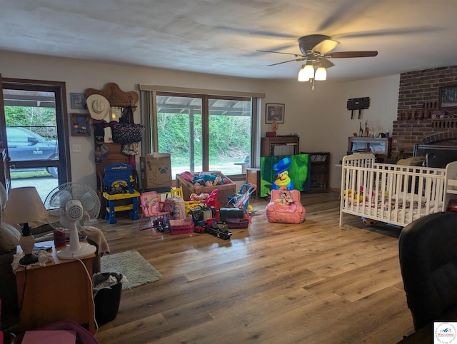 418 W Gravel St, Clinton, MO 64735 - bedroom featuring wood finished floors and ceiling fan