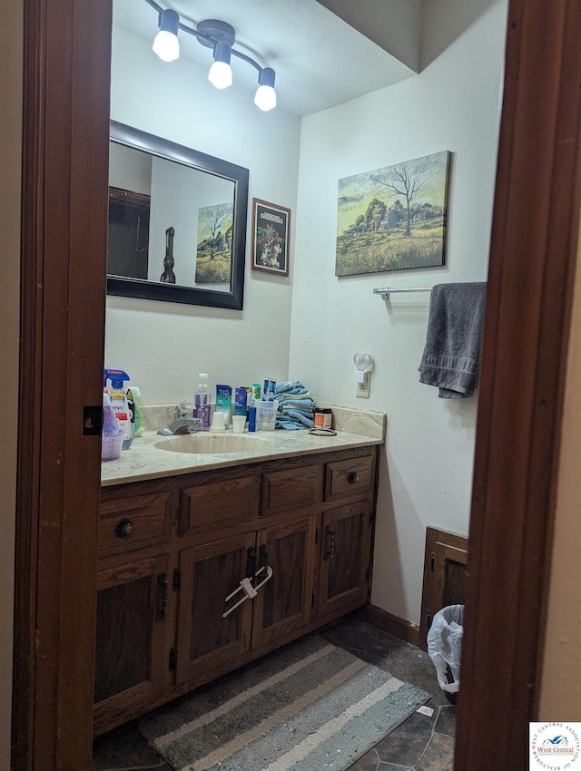 418 W Gravel St, Clinton, MO 64735 - bathroom with vanity and baseboards